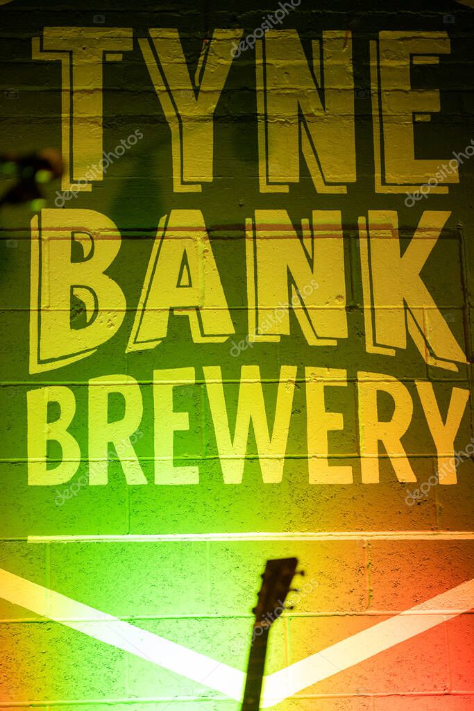 Newcastle UK: Nov 2022: Tyne Bank Brewery banner lit up in colourful lights (no people)