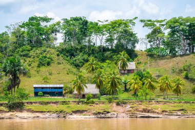 iquitos, peru. 10th september, 2022: shanty village at peruvian amazon riverbank