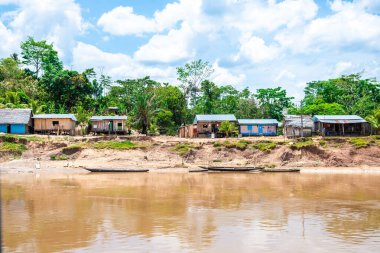 iquitos, peru. 10th september, 2022: shanty village at peruvian amazon riverbank