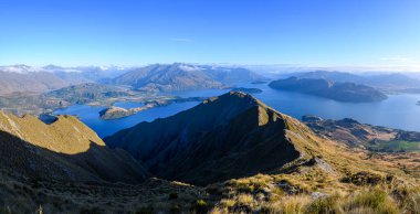 panoramic views of roys peak mountains, and wanaka lakes at background