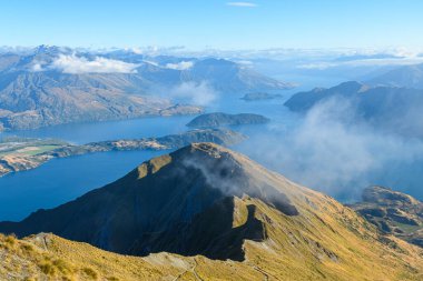 panoramic views of roys peak mountains, and wanaka lakes at background