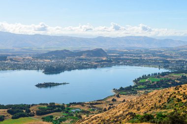 panoramic views of roys peak mountains, and wanaka lakes at background