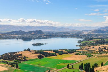 panoramic views of roys peak mountains, and wanaka lakes at background