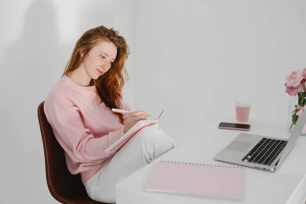 Relaxed Pensive Young Redhead Woman Sitting Workplace Office Making Notes Stock Photo