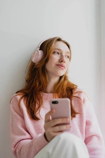 Happy Calm Adorable Redhead Female Wearing Pink Headphones Listening Favorite Royalty Free Stock Images