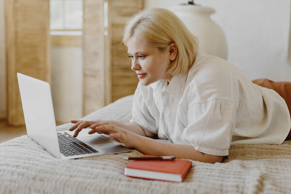 Beautiful Blonde Woman Lying Bed Using Laptop Royalty Free Stock Images