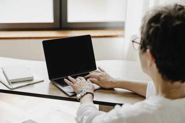 Back View Senior Business Woman Using Laptop While Working Home Royalty Free Stock Photos