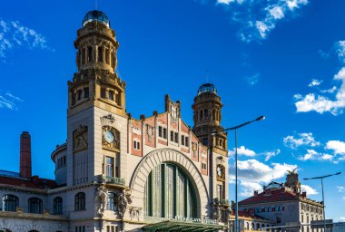 The facade of Prague Main Railway Station - Art Nouveau architecture. Historic station with features elaborate decorative elements, intricate detailing, and grand arches that reflect the elegance and clipart