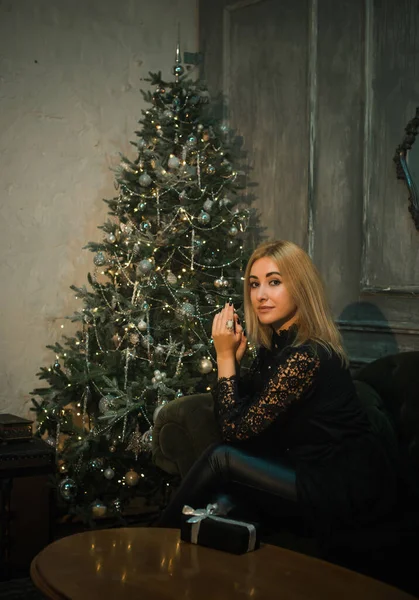 Vintage aesthetic of Christmas Holidays. Woman in pretty cozy home atmosphere