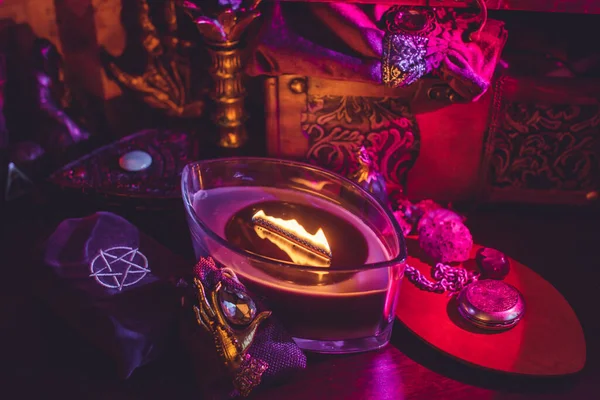 Candle burns on the altar, candles magic, clean aura and removing negative energy, wicca concept