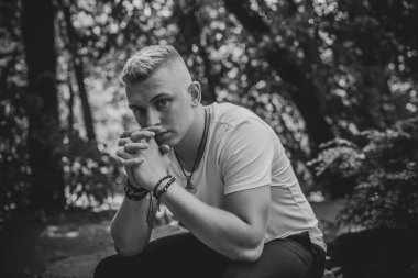 Young man in sadness or depression, grief and bad mood. Psychology problems among guys. Image sad guy thinking about something