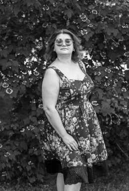 Plus size European mature woman in stylish romantic women's clothes dress. Concept of sizes, happy nice natural beautiful lady 