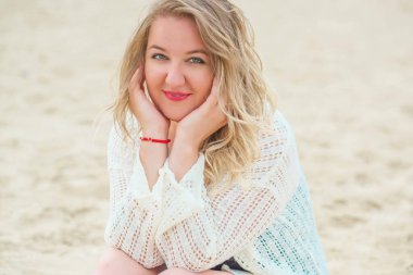 Plus size European blonde woman in stylish romantic women's summer clothes at beach. Concept of sizes, happy nice natural beautiful lady 