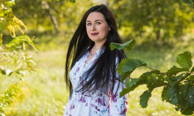 Woman with a pale skin, in stylish romantic women's clothes. Concept of body types and sizes, ladies fashionable look