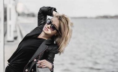 Grunge style, 90-80x trends clothes collection. Woman in black leather jacket. Fashion illustration for magazine