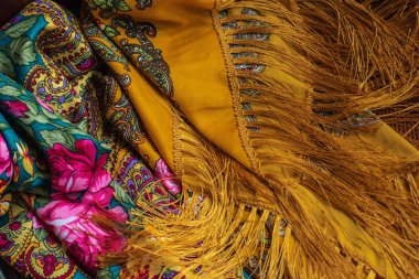 Colorful Boho flowers fabric. Fashionable collection of accessories for women. Detail of wardrobe