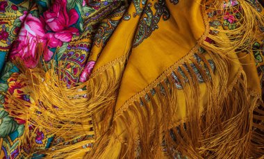 Colorful Boho flowers fabric. Fashionable collection of accessories for women. Detail of wardrobe