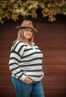 Dissatisfied citizen, the problems of middle aged women. Older plus size woman portrait, she is on one with her own thoughts