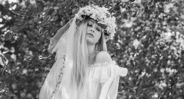 Tender Bride woman at nature, traditional real European lady with a long blond hair in white lace dress and wreath