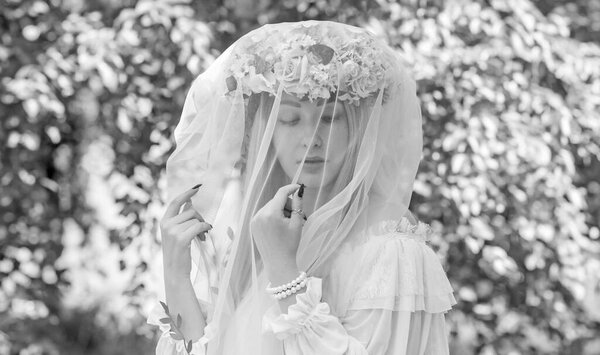 Tender Bride woman at nature, traditional real European lady with a long blond hair in white lace dress and wreath