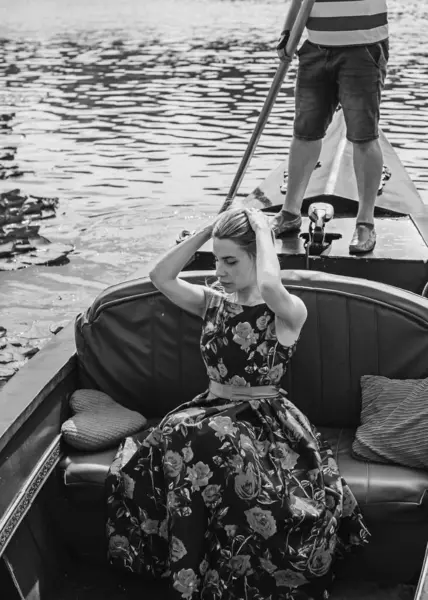 Tourist Pretty blonde woman on a boat. Romantic scene, vacation nice moments