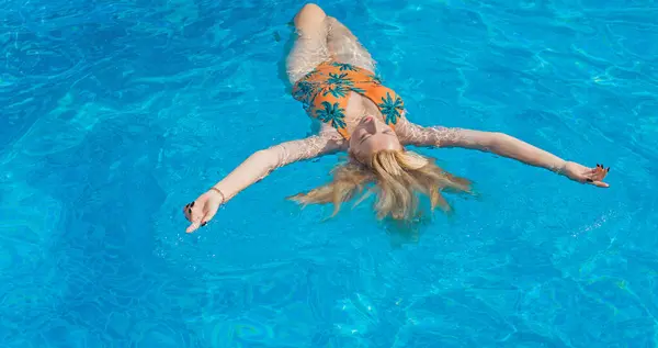 stock image Woman at the pool. Concept of recreation and relaxing. Beautiful lady on weekend taking sunbath