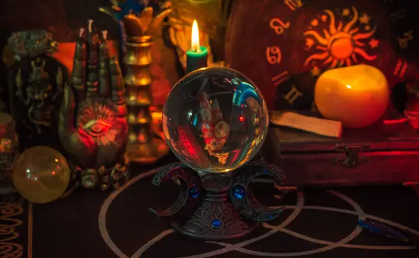 stock image Table with candles and esoteric stuff. Herbs and wax around. Rite concept 