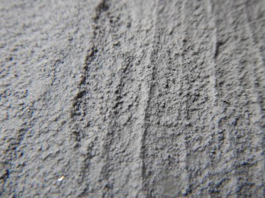 Gri taştan duvar manzarasını kapat. Eski gri çimento duvar arka planı.