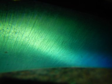 Bukalemun metal bıçak desenli soyut bir arka plan.