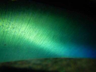 Bukalemun metal bıçak desenli soyut bir arka plan.