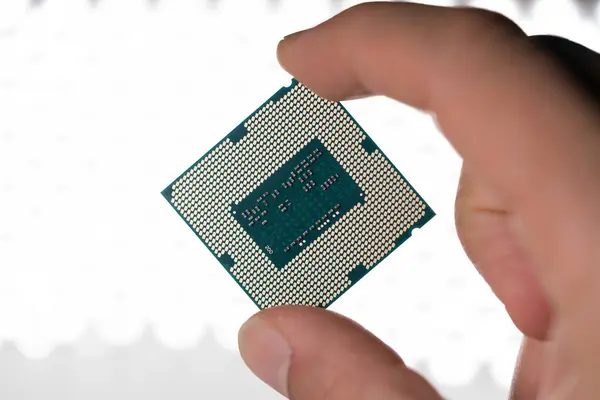 modern computer processor in hand, close up