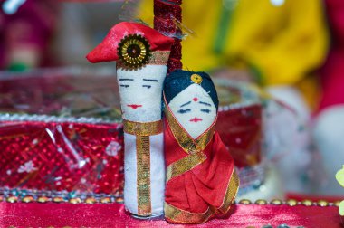 Indian wedding or marriage dolls for decorations. Small show piece of bride and groom Indian wedding culture. Traditional wedding set doll in Indian wedding. clipart