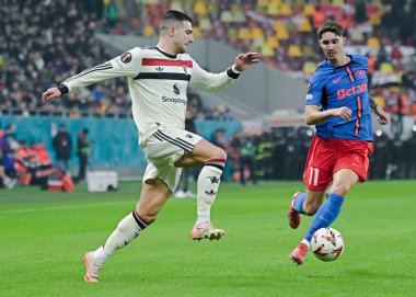 Diogo Dalot (Man Utd) and David Miculescu (FCSB) pictured during the UEFA Europa League Group Stage game between FCSB (Romania) and Manchester United (England) held on 30th of January 2025 at National Arena in Bucharest. clipart