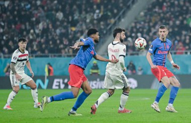 Bruno Fernandes (Man Utd) and Florin Tanase (FCSB pictured during the UEFA Europa League Group Stage game between FCSB (Romania) and Manchester United (England) held on 30th of January 2025 at National Arena in Bucharest. clipart