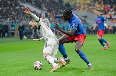 Christian Eriksen (Man Utd) and Joyskim Dawa (FCSB) pictured during the UEFA Europa League Group Stage game between FCSB (Romania) and Manchester United (England) held on 30th of January 2025 at National Arena in Bucharest. clipart