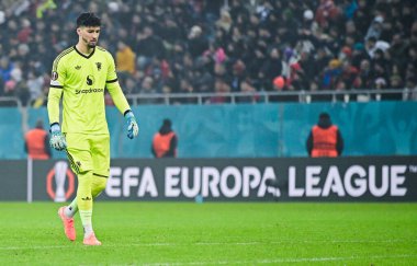 Altay Bayindir (Man Utd), 30 Ocak 2025 tarihinde Bükreş 'teki Ulusal Arena' da düzenlenen FCSB (Romanya) ile Manchester United (İngiltere) arasındaki UEFA Avrupa Ligi Sahne Oyunu sırasında çekilmiştir..
