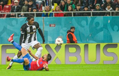 Joel Monteiro of Young Boys challenged by Valentin Cretu of FCSB.