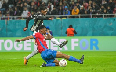 Joel Monteiro shoots to score past Siyabonga Ngezana during the 2025/26 UEL Matchday 2 game Between FCSB (ROU) and BSC Young Boys (SWI).