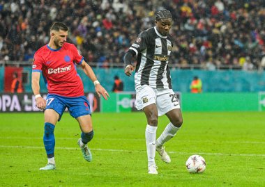Mihai Popescu and Chris Bedia pictured during the 2025/26 UEL Matchday 2 game Between FCSB (ROU) and BSC Young Boys (SWI).