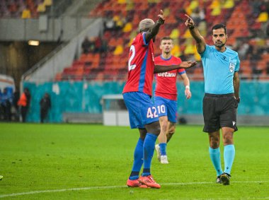 Polish FIFA referee Pawel Malec gestures during the 2025/26 UEL Matchday 2 game Between FCSB (ROU) and BSC Young Boys (SWI).