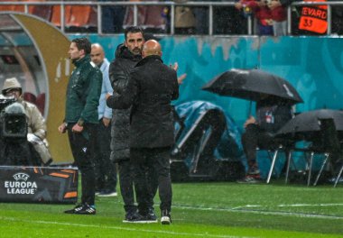 Elias Charalambous congratulates Giorgio Contini after the 2025/26 UEL Matchday 2 game Between FCSB (ROU) and BSC Young Boys (SWI).