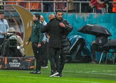 Elias Charalambous hugs Giorgio Contini after the 2025/26 UEL Matchday 2 game Between FCSB (ROU) and BSC Young Boys (SWI).