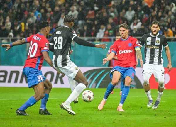 David Miculescu and Jaouen Hadjam pictured during the 2025/26 UEL Matchday 2 game Between FCSB (ROU) and BSC Young Boys (SWI).