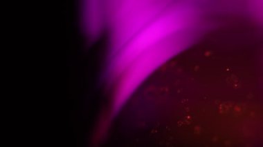 Turuncu parçacıklar pembe ve siyah arkaplanda, sıvı parlak yüzeyde hareket ediyorlar.