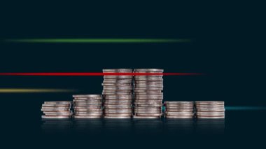 A pile of coins and heartbeat graphic. Concepts about the economic crisis.