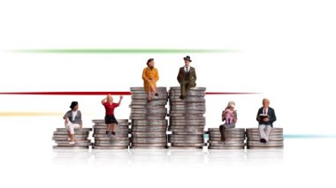 Business concept with coins and miniature people. Various miniature people sitting on piles of coins of different heights.