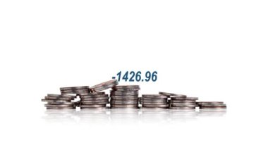 A pile of coins and graphics. Concepts about the economic crisis.