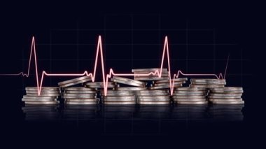 Business concept with coins and graphics. Pile of coins and heartbeat graph.
