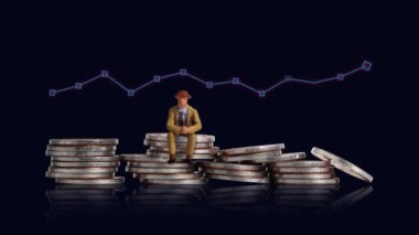 A miniature man sitting on a pile of coins with a graph. Business concept with coins and graphics.