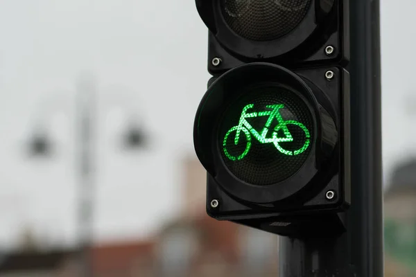 Sustainable transport. Bicycle traffic signal, green light, road bike, free bike zone or area, bike friendly, close up
